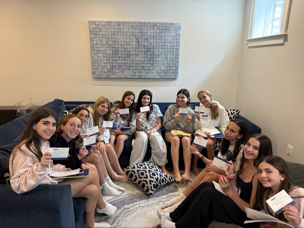 Safe Sitter graduates holding their certificates after class